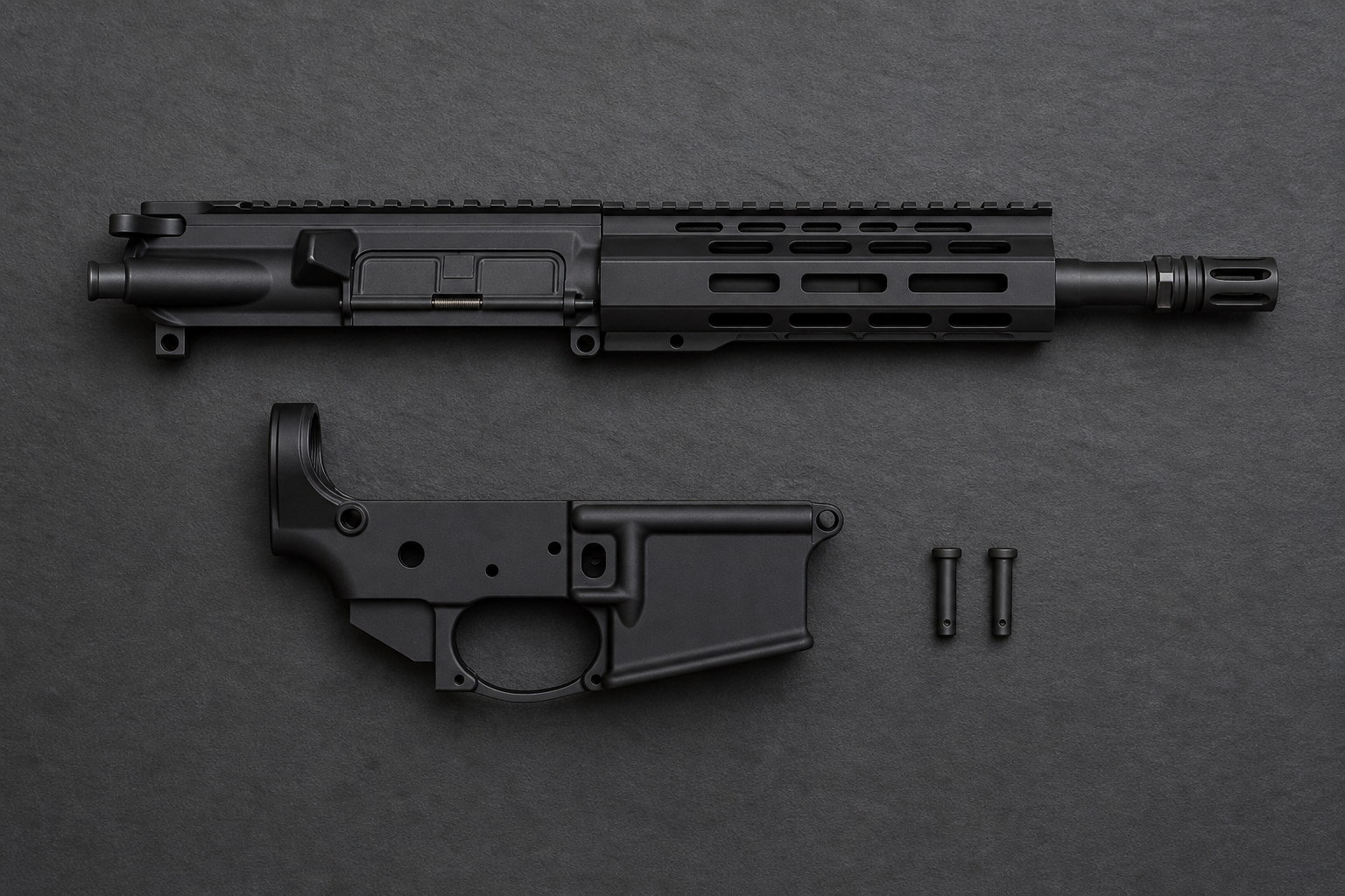 A complete black AR-15 upper receiver with M-LOK handguard and muzzle device laid above a stripped lower receiver and two takedown pins on a dark slate background.