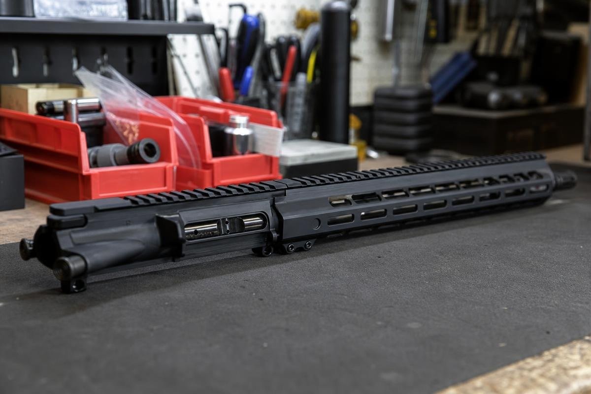 A complete 338 ARC upper receiver assembly resting on a workbench in a shop environment.