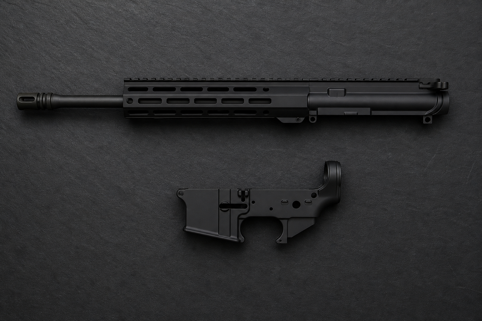 A complete black AR-15 upper receiver with M-LOK handguard and muzzle brake positioned above a stripped lower receiver on a dark slate surface.