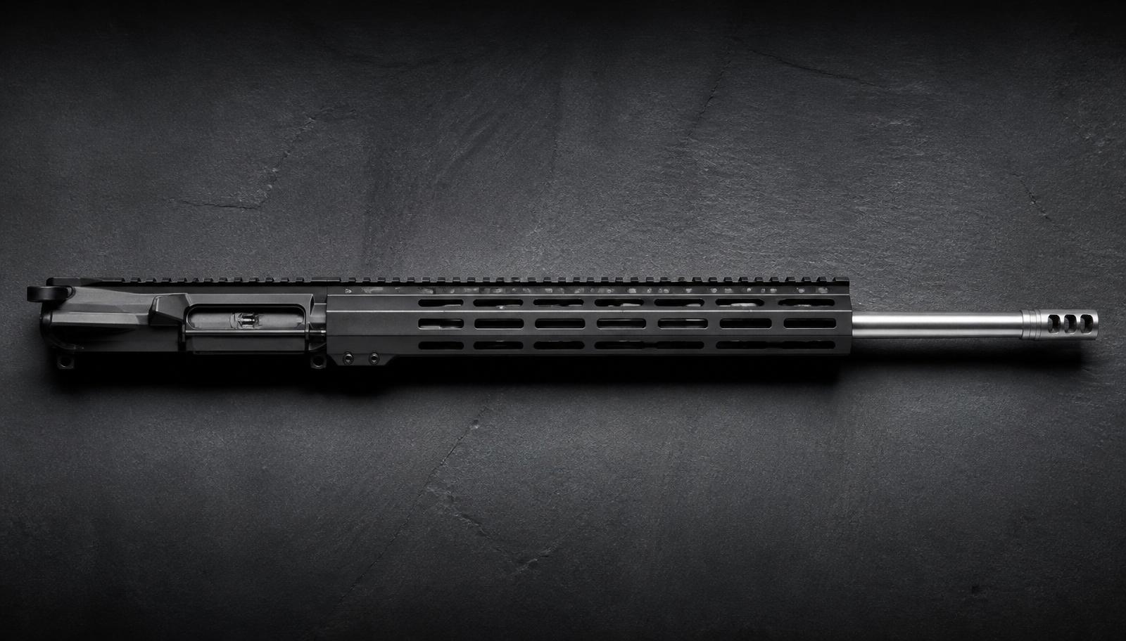 AR-10 complete upper receiver chambered in .308 Winchester with a 20 inch stainless bull barrel and M-LOK handguard on dark slate.