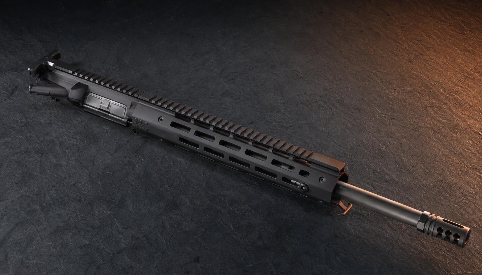 A mid-tier complete AR-15 upper receiver with a 16 inch cold hammer forged barrel and quality M-LOK free float handguard on dark slate.