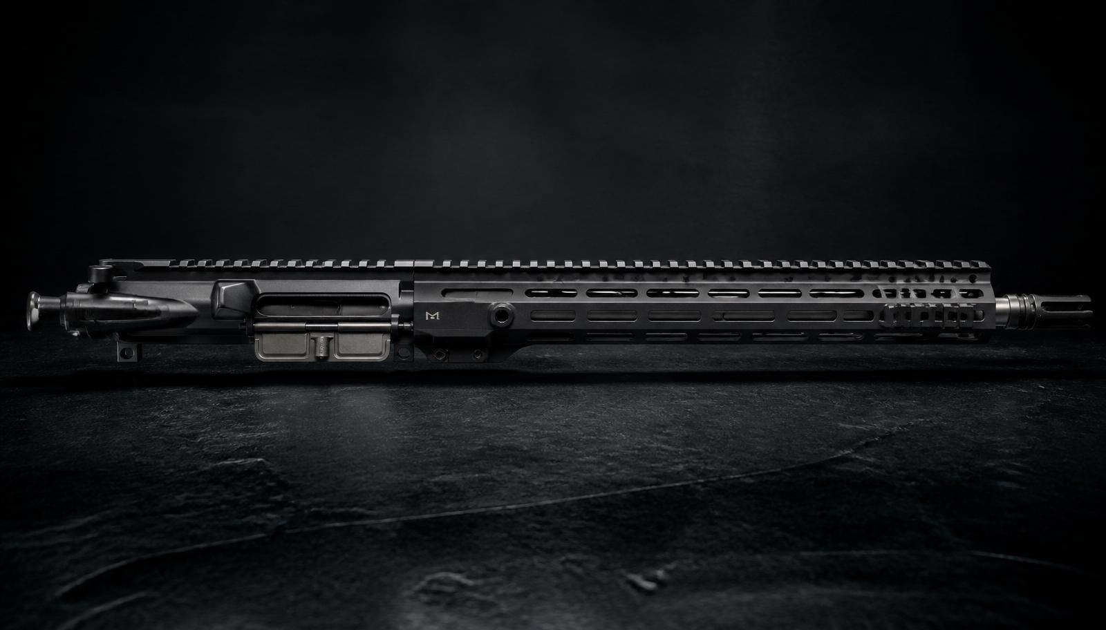 A premium billet AR-15 upper receiver with ambidextrous charging handle, match stainless barrel, and premium M-LOK handguard on dark slate.